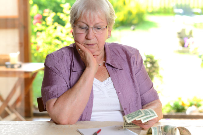 elderly counting money